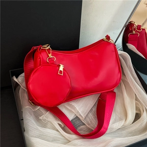 Chic red single shoulder bag set with a round coin purse in a premium gift box setup