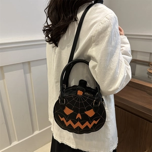 Fashionable black pumpkin-shaped crossbody bag with orange embroidery for Halloween style