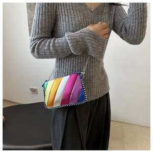 Detail of colorful metallic crossbody bag with silver chain strap and rivet trim