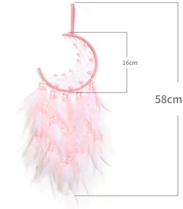 Macro detail of pink moon dreamcatcher with feathers showing dimensions of 16cm and 58cm