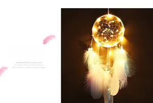 Detail of DIY dream catcher with LED lights, delicate faux flowers and colorful soft feathers