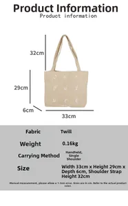 Detail view of corduroy tote bag showing size specs and Our Future embroidery