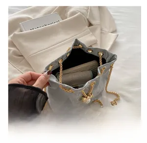 Macro view of textured bucket bag interior showing capacity for phone and wallet