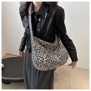 Fashionable leopard print large capacity crescent tote bag on model for casual styling