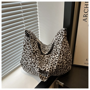 Close-up of leopard print canvas tote bag with a focus on texture and pattern
