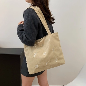 Minimalist beige corduroy tote bag with white embroidery for daily casual wear