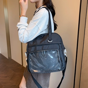 Black canvas tote bag with transparent PVC window and white buckles for women