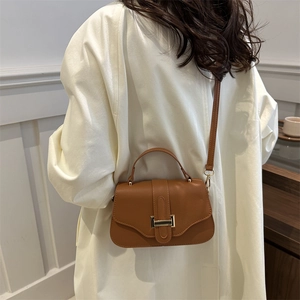 French vintage brown faux leather underarm bag with gold buckle and top handle