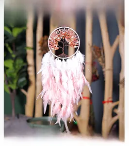 Detail of pink crystal chips on copper life tree dream catcher with feathers