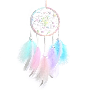 Handmade dreamcatcher with soft colorful feathers and beads for wall hanging decor