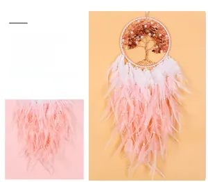 Detail of pink and white gradient feathers on the Tree of Life dreamcatcher pendant