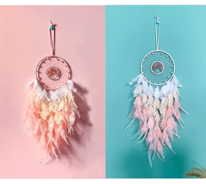 Close-up of tree of life dreamcatchers with pastel feathers and crystal stone beads