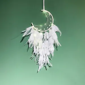 White moon-shaped dream catcher with warm LED lights and elegant hanging feathers