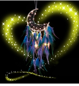 Detail of moon-shaped dreamcatcher with warm LED lights and colorful feathers