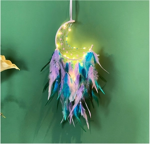 Moon-shaped dreamcatcher detail with LED lights and multi-colored hanging feathers