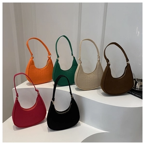 Detail of hobo underarm bags showing crocodile texture in six vibrant colors and soft lighting