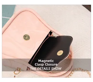 Close-up of pink marble pattern handbag featuring a gold magnetic snap closure system