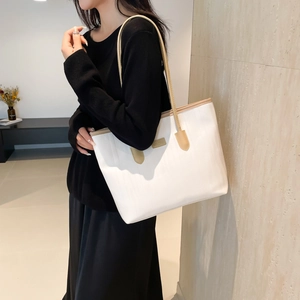 Large beige tote bag with light brown straps for casual work and daily commuting
