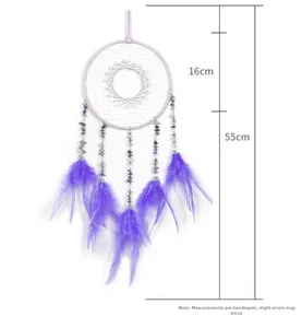 Detailed size view of a handmade purple dreamcatcher with feathers and crushed stones