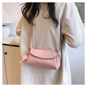 Pink lychee grain leather crossbody bag with flap and cute elephant charm detail