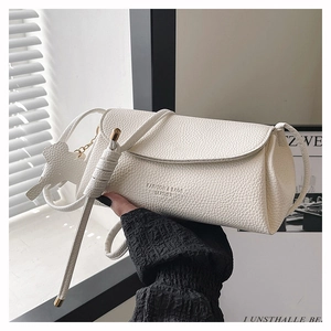 Detail of white pebble grain leather shoulder bag with FASHION & BAGS branding