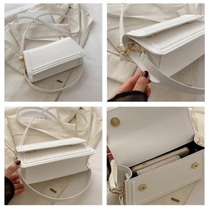 Vue détaillée du sac bandoulière en cuir blanc avec boucle aimantée dorée et intérieur