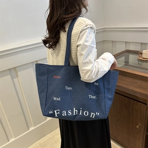 Minimalist large capacity denim tote bag with weekly lettering and fashion print on blue fabric