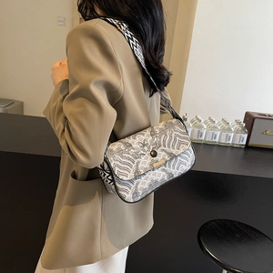 Sac bandoulière chic à motif ondulé noir et blanc avec large bandoulière géométrique