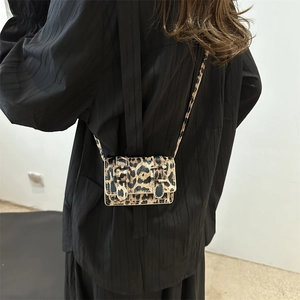 Chic leopard print mini crossbody bag for women with dual black buckle straps