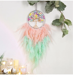 Macro shot of colorful heart beads and tree of life design on bohemian dream catcher