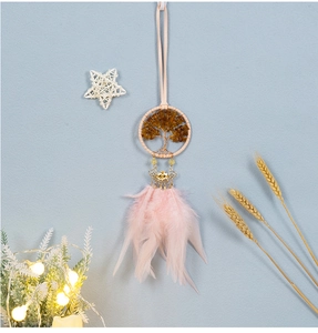 Detail of pink feather dreamcatcher with Tree of Life gemstone weaving and gold petals