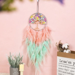 Colorful tree of life dreamcatcher with pink and mint green feathers for home decor