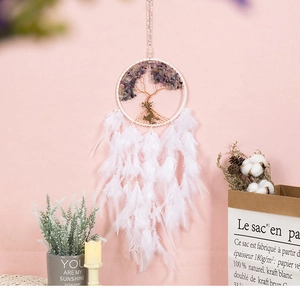 Detailed view of handmade dream catcher with purple crystal tree and gold deer pendant