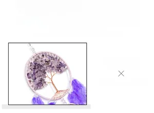 Detailed weave of Tree of Life amethyst beads and purple feathers on dreamcatcher