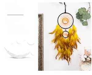 Detail of bohemian life tree dream catcher with bright yellow feathers and orange weaving