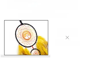Detailed view of Tree of Life crystal pendant with woven hoop and yellow feathers