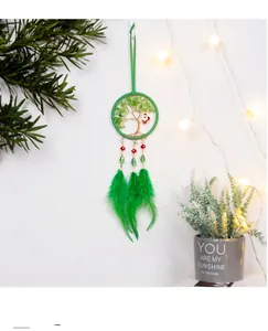 Detailed view of Tree of Life Christmas dreamcatcher with green feathers and Santa charm