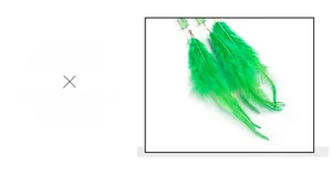 Detail view of green feather earrings with translucent bead and metal hook