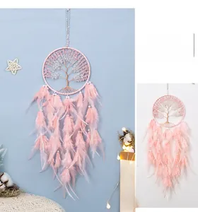 Detail of pink Tree of Life dreamcatcher with soft feathers and crystal beads