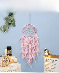 Detailed view of pink Tree of Life dreamcatcher with crystal stones and soft feathers