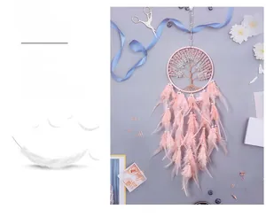 Detail of pink Tree of Life dreamcatcher with crystal stones and soft feathers