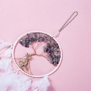 White dream catcher with golden tree of life, colorful stones, and a deer head charm