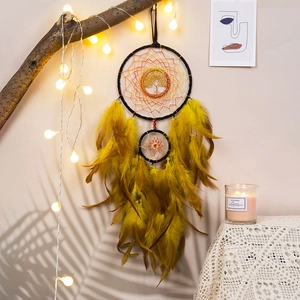 Handmade yellow Tree of Life dream catcher with natural feathers for home decor