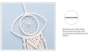 Close-up of handmade boho evil eye tapestry showing tight cotton weave and tassel details