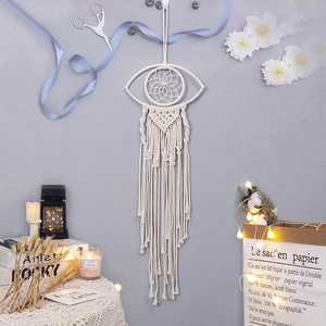 Bohemian ivory cotton woven eye-shaped tapestry wall hanging with macrame fringe detail