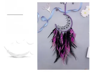 Detail of moon-shaped dreamcatcher featuring purple feathers and elegant pearl accents