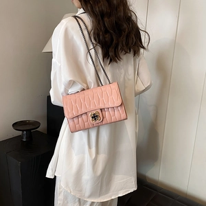 Pink embossed crocodile leather crossbody bag with golden flower clasp and chain