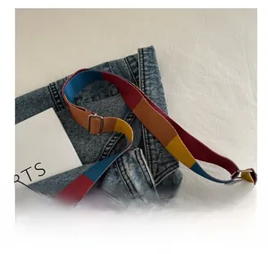 Detail of multi-color adjustable canvas shoulder strap with high-quality metal buckle