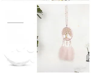 Detailed view of pink life tree dream catcher with natural stones and soft feathers