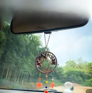 Detail of tree of life car charm with colorful crushed stones and orange maple leaf pendants